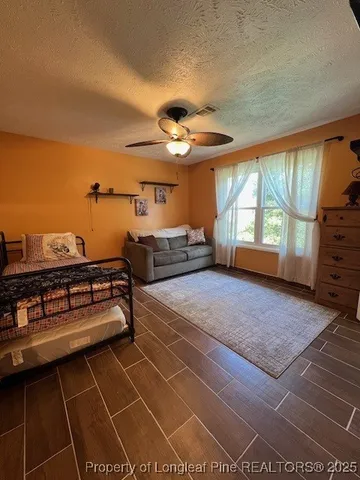 a bedroom with furniture and window