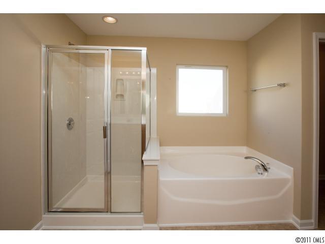 2183 Durand Road, Unit 84 Fort Mill, SC 29715 - Photo 13 of 16 a bathroom with a bathtub and a shower
