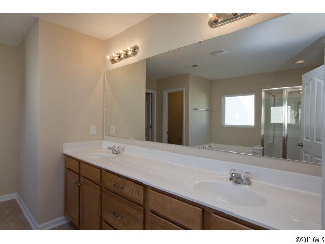 2183 Durand Road, Unit 84 Fort Mill, SC 29715 - Photo 14 of 16 a bathroom with a sink double vanity and a mirror