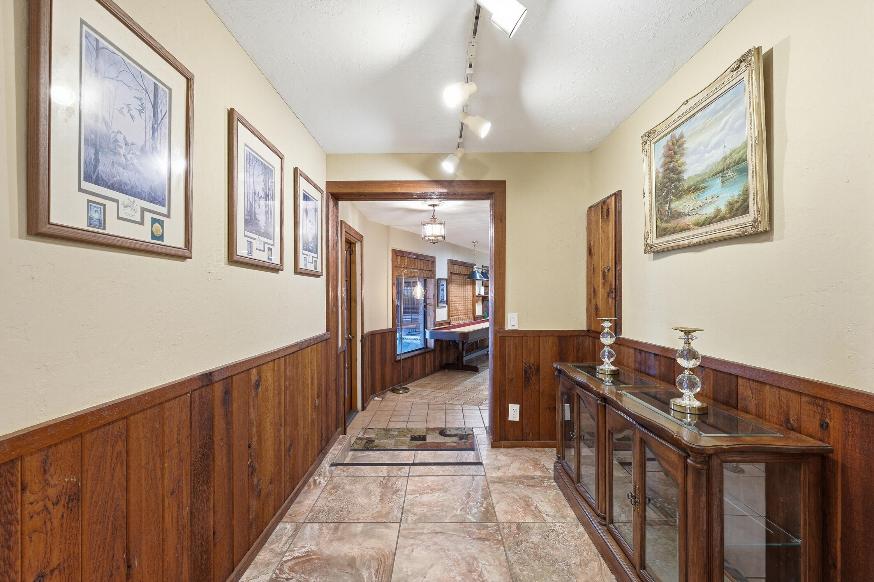 200 Windy Point Road Lake Placid, FL 33852 - Photo 17 of 74 a view of a hallway to a livingroom with furniture