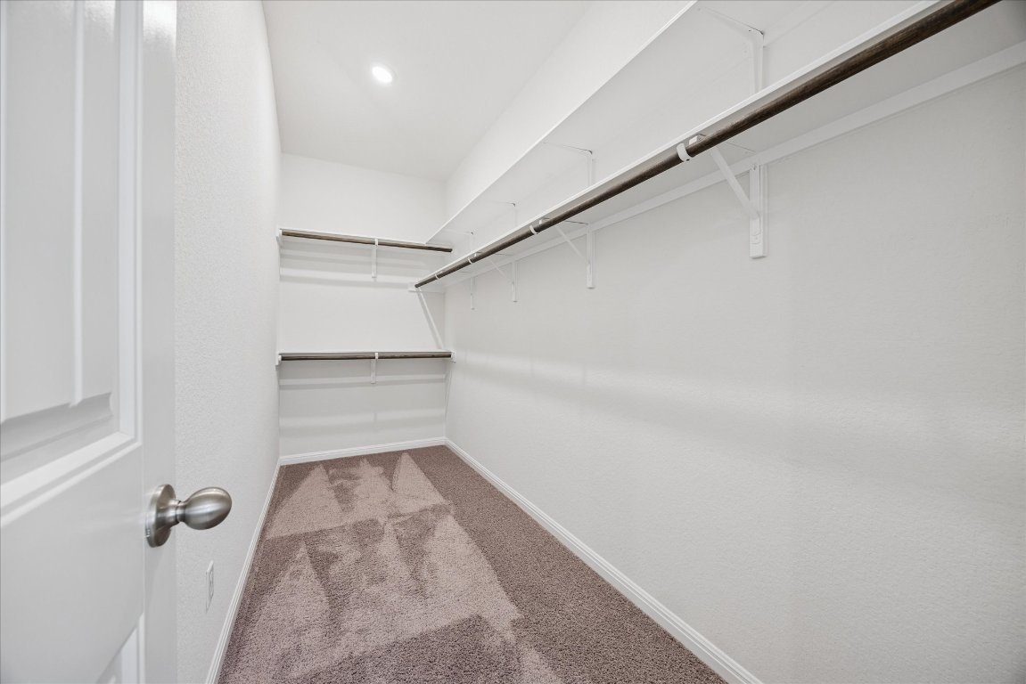 19201 Quebrada Drive Pflugerville, TX 78660 - Photo 14 of 22 a view of a room with racks on the wall