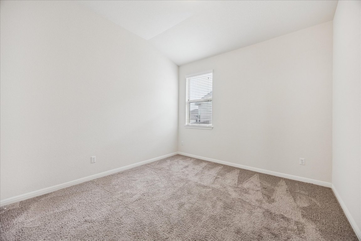 19201 Quebrada Drive Pflugerville, TX 78660 - Photo 15 of 22 an empty room with windows