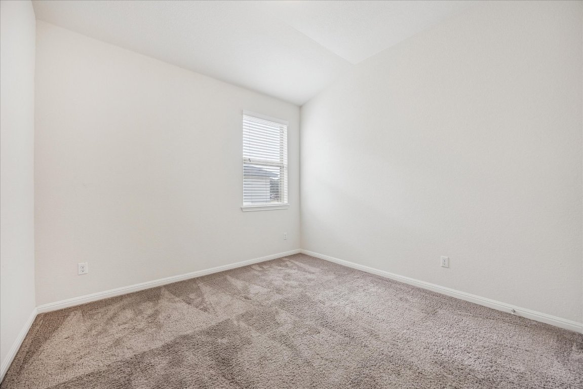 19201 Quebrada Drive Pflugerville, TX 78660 - Photo 17 of 22 an empty room with windows