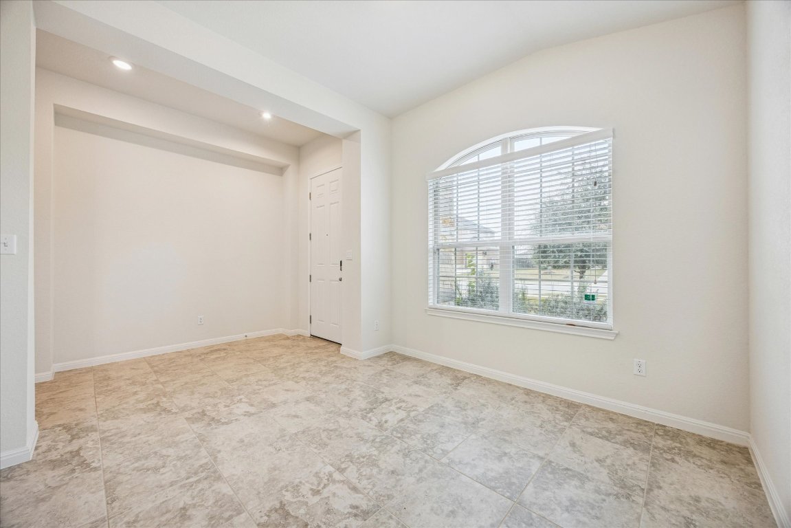 19201 Quebrada Drive Pflugerville, TX 78660 - Photo 4 of 22 an empty room with windows