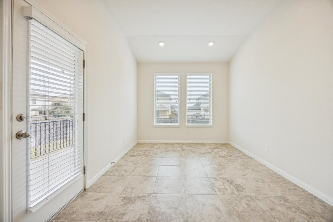 19201 Quebrada Drive Pflugerville, TX 78660 - Photo 10 of 22 an empty room with windows