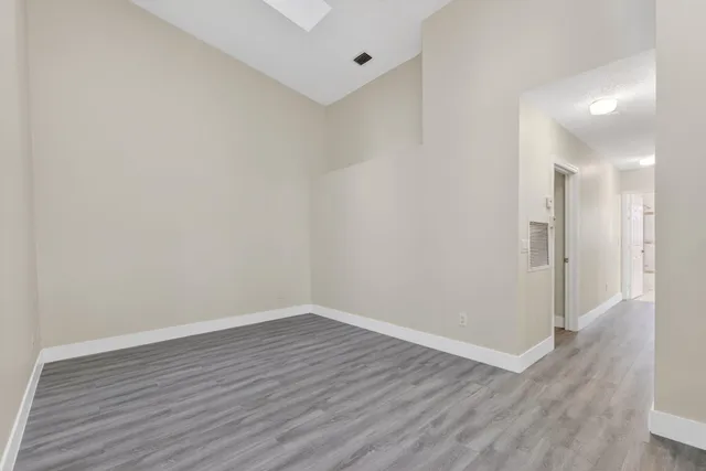 a view of a hardwood floor and a in an empty room