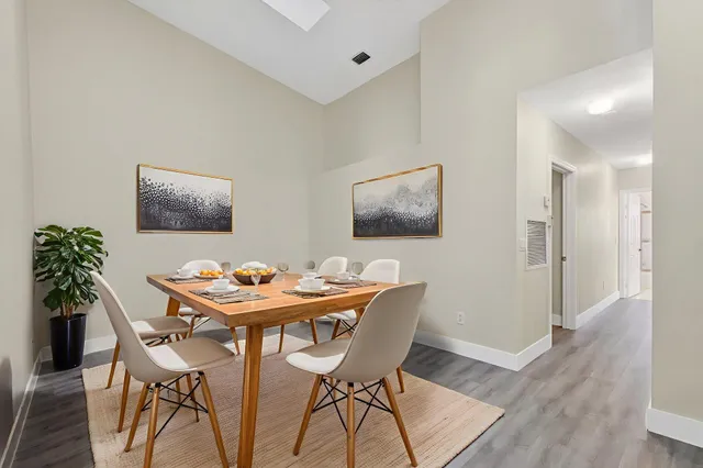 a kitchen with sink cabinets and wooden floor