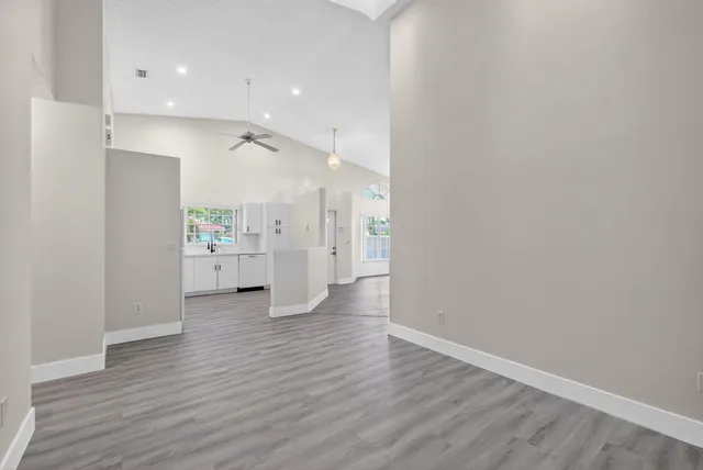 a kitchen with a white cabinets and white appliances