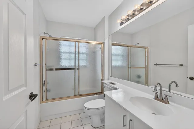 a bathroom with a double vanity sink mirror and double