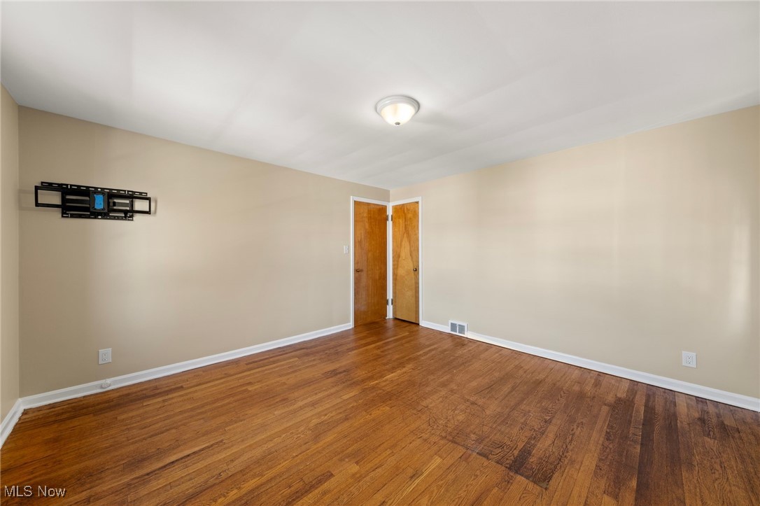 13517 Cedar Road Cleveland, OH 44118 - Photo 7 of 30 Unfurnished room featuring hardwood / wood-style flooring