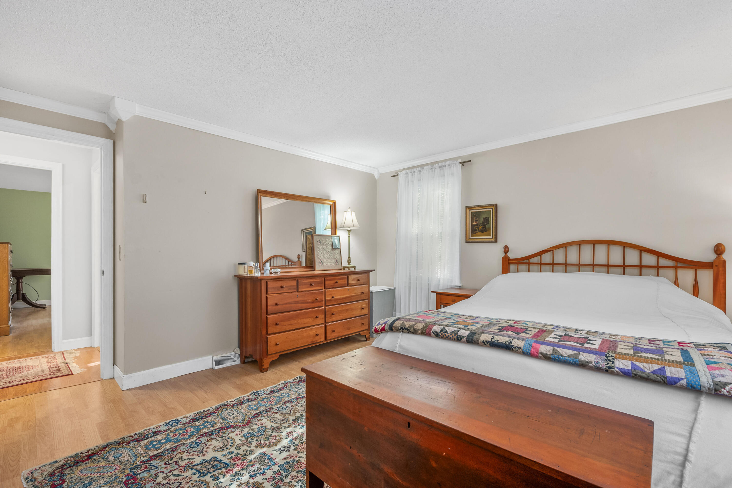 43 Chipman Road Sandwich, MA 02563 - Photo 18 of 35 a bedroom with a bed and a dresser