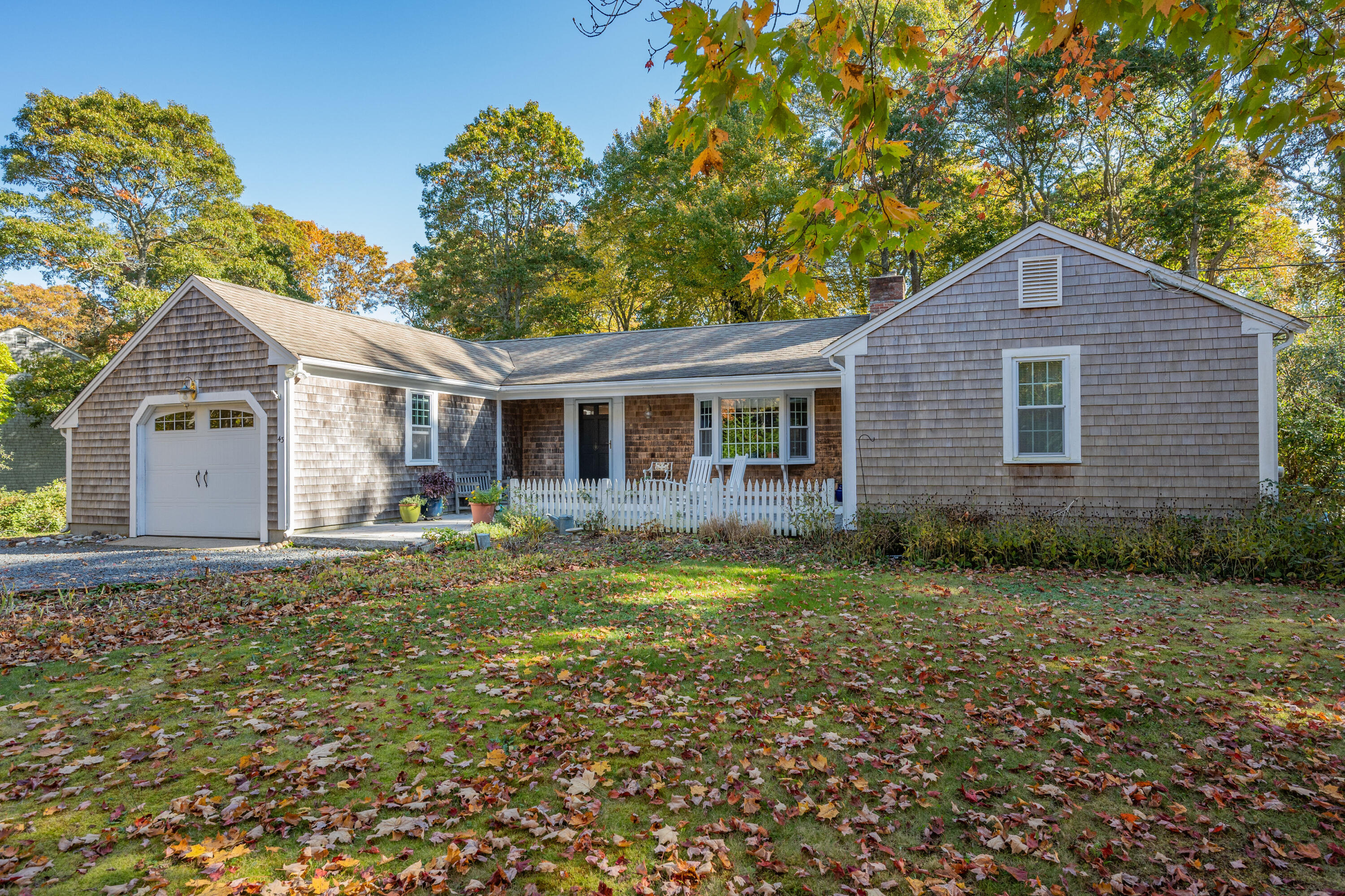 43 Chipman Road Sandwich, MA 02563 - Photo 4 of 35 a view of a yard in front of a house with large trees