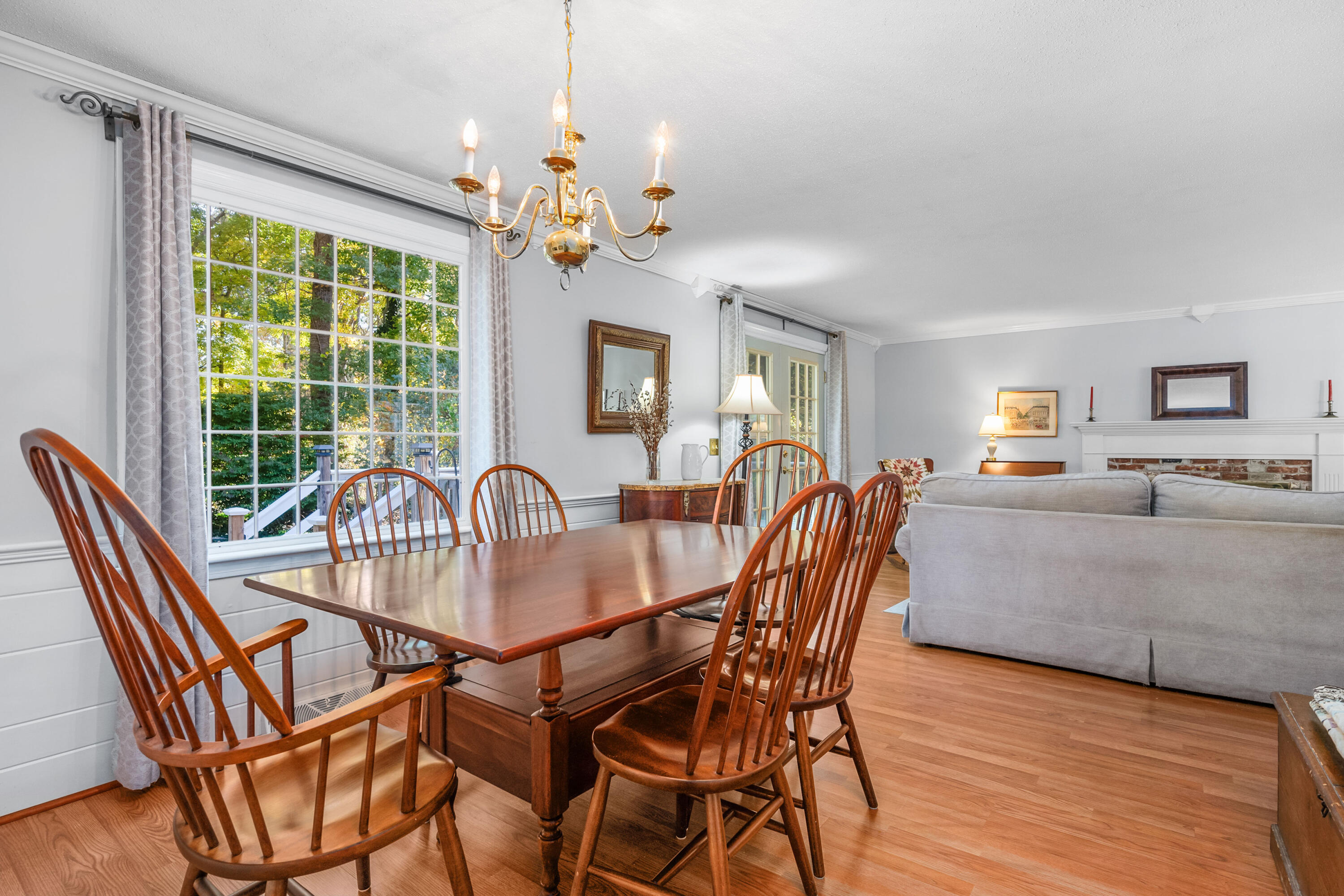 43 Chipman Road Sandwich, MA 02563 - Photo 10 of 35 a dining room with furniture a chandelier and wooden floor