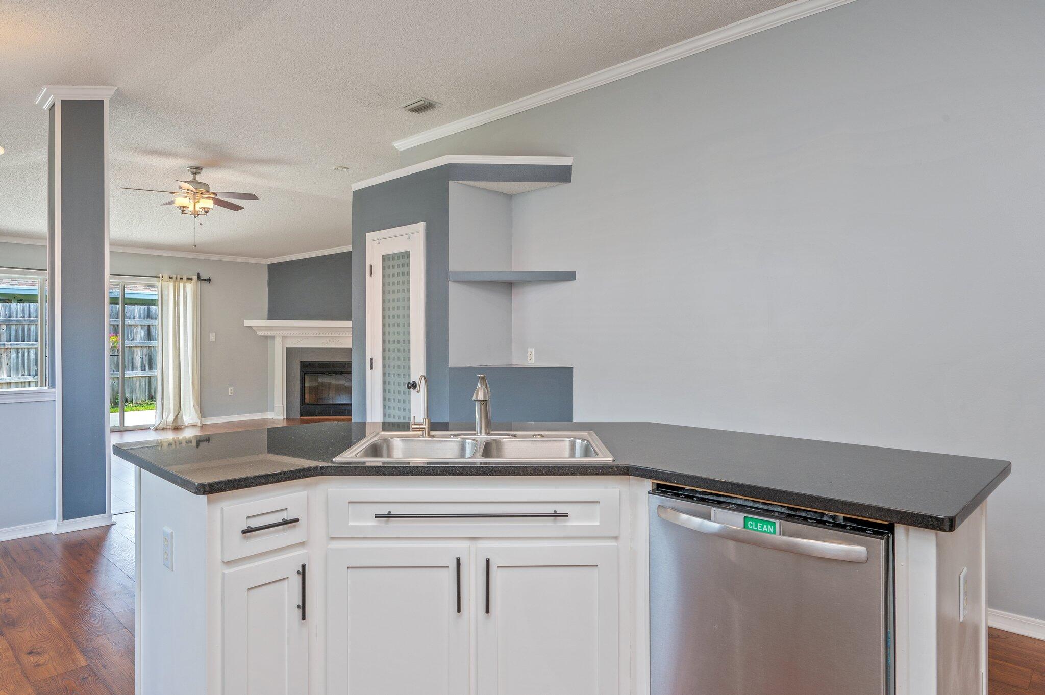 695 Randall Roberts Road Fort Walton Beach, FL 32547 - Photo 15 of 40 a view with granite countertop stainless steel appliances a sink and a window