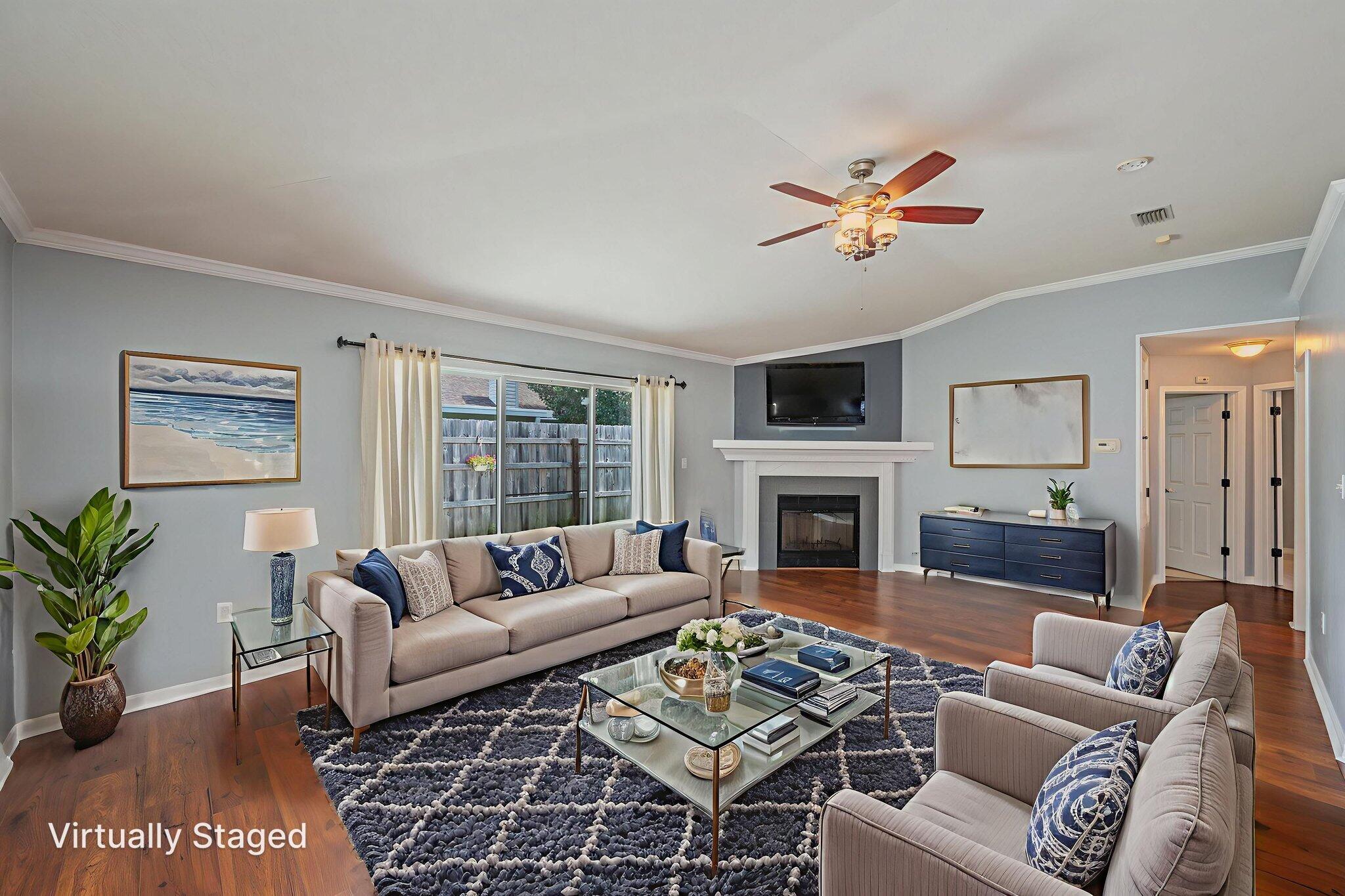 695 Randall Roberts Road Fort Walton Beach, FL 32547 - Photo 19 of 40 a living room with furniture a fireplace and a flat screen tv
