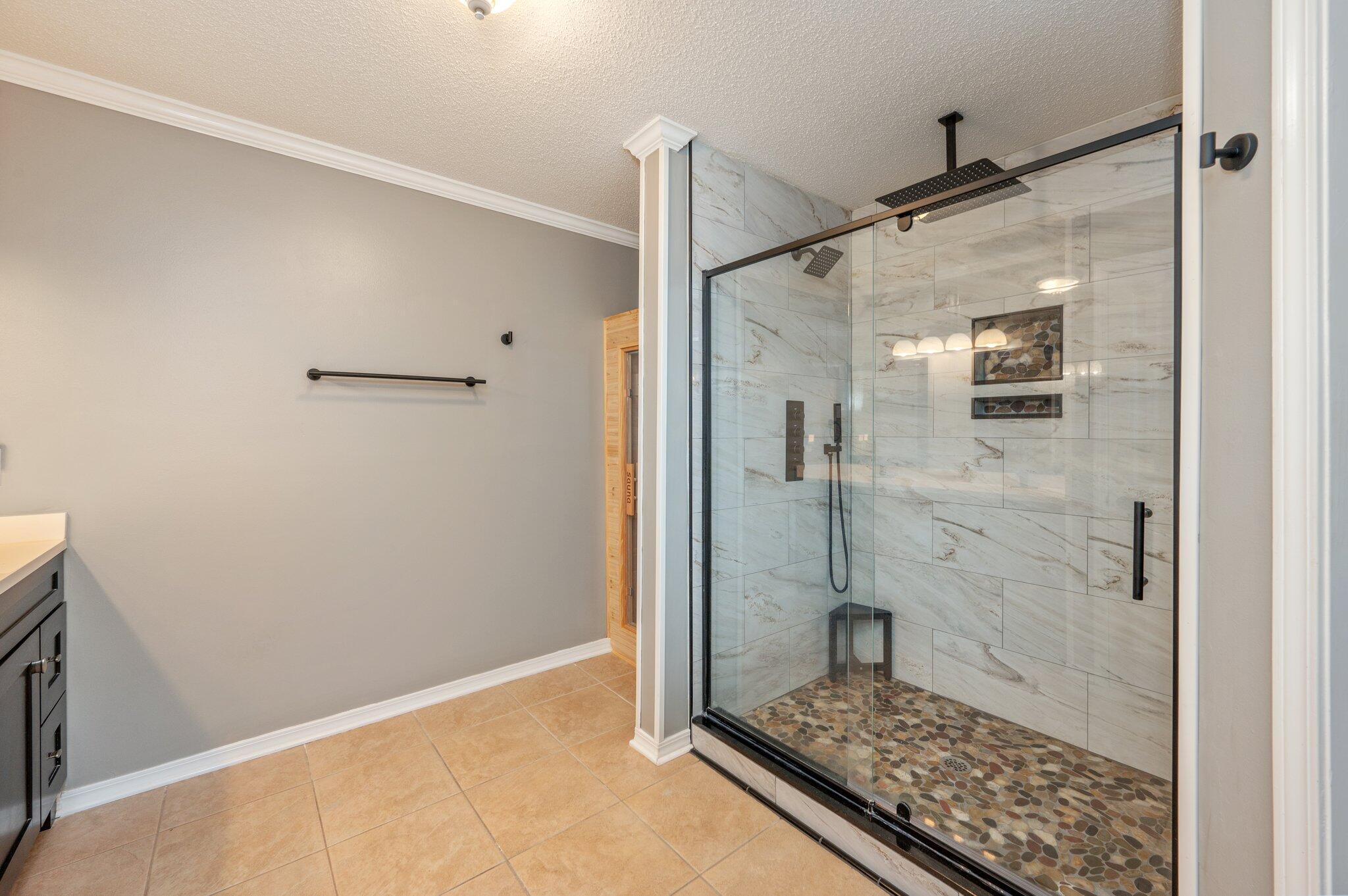 695 Randall Roberts Road Fort Walton Beach, FL 32547 - Photo 27 of 40 a bathroom with a glass shower door