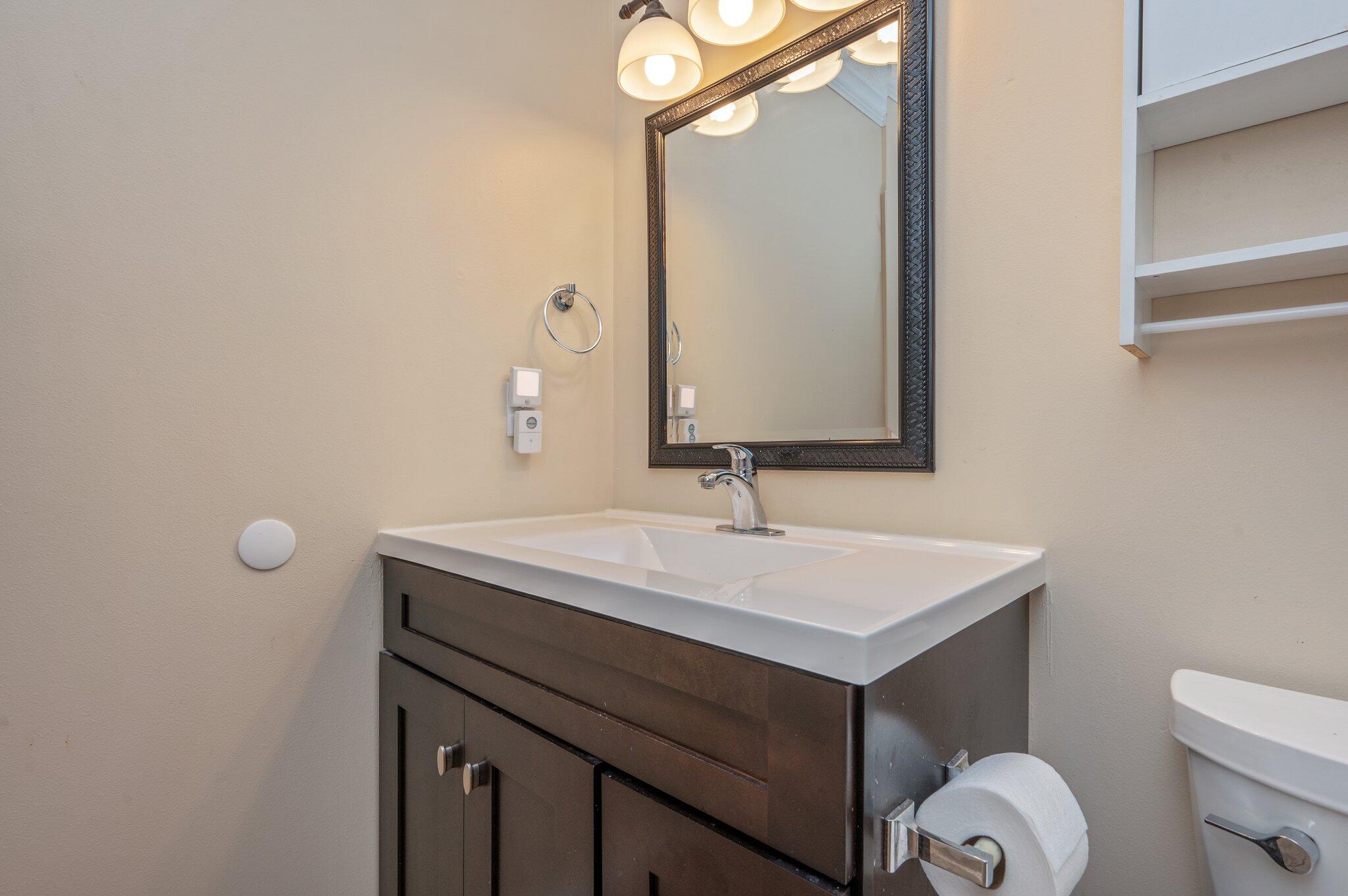695 Randall Roberts Road Fort Walton Beach, FL 32547 - Photo 31 of 40 a bathroom with a sink vanity and a mirror
