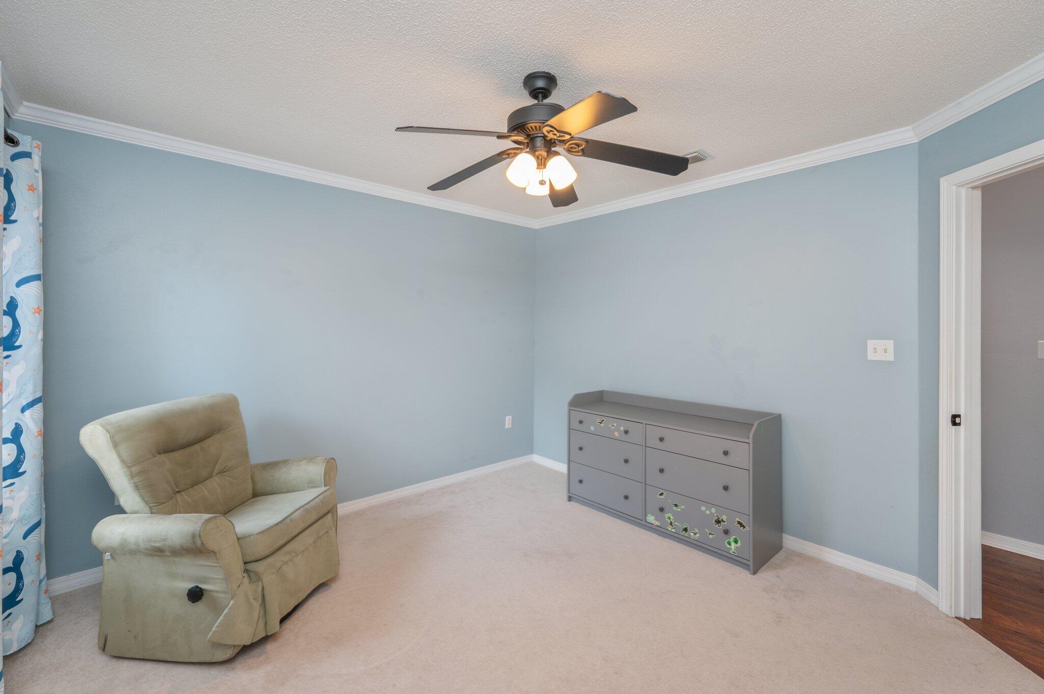 695 Randall Roberts Road Fort Walton Beach, FL 32547 - Photo 34 of 40 a bedroom with a bed and a couch