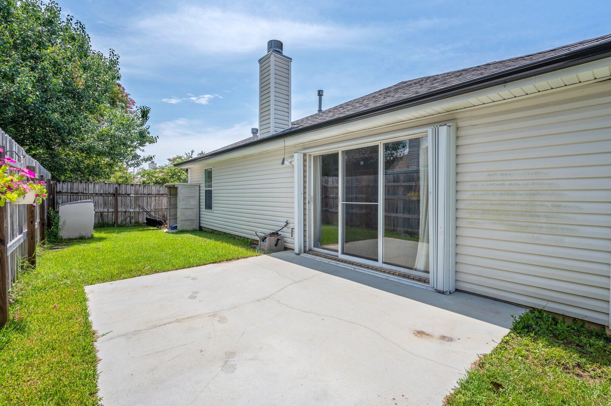 695 Randall Roberts Road Fort Walton Beach, FL 32547 - Photo 38 of 40 a view of a house with a backyard and a tree