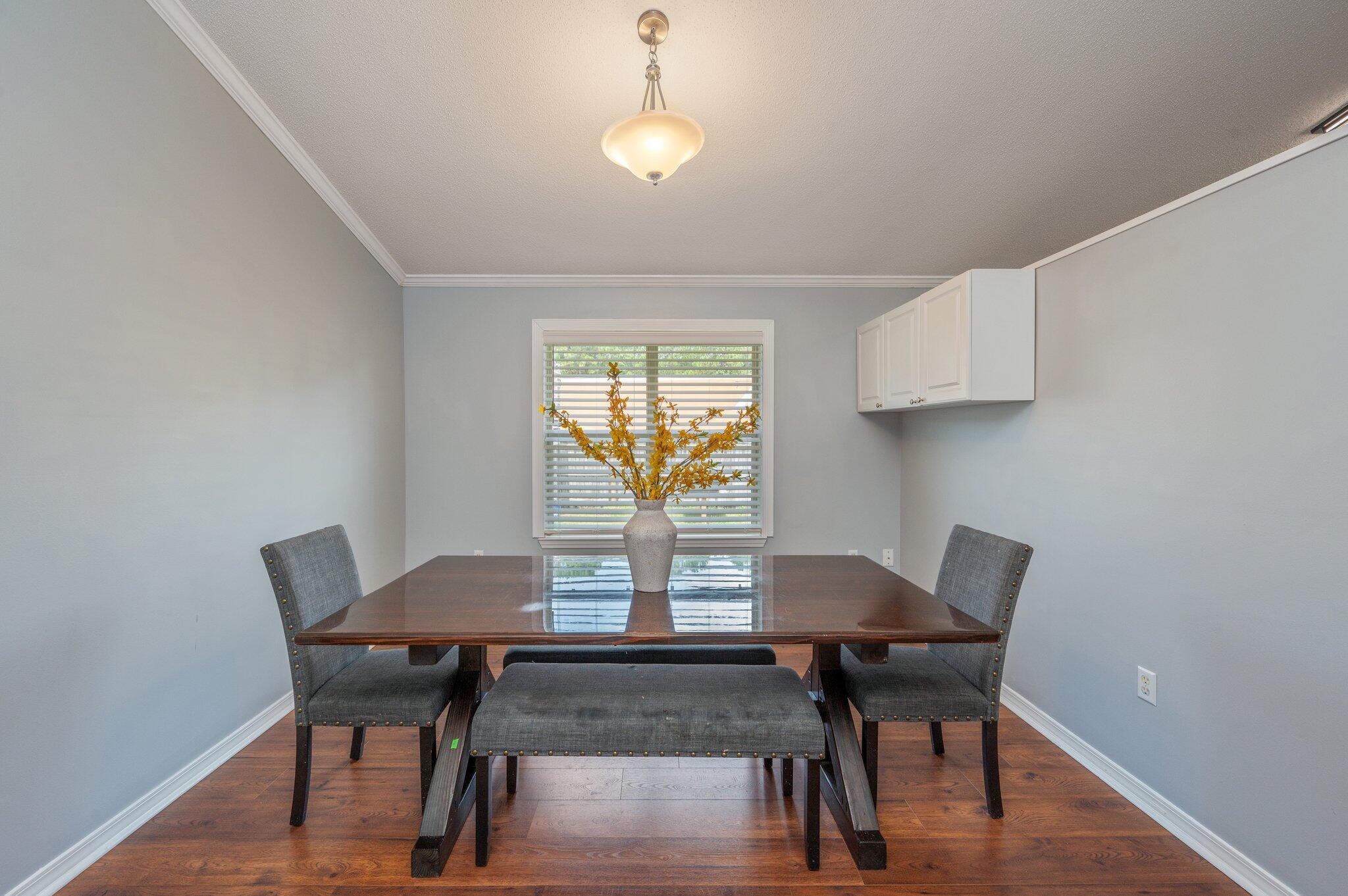 695 Randall Roberts Road Fort Walton Beach, FL 32547 - Photo 9 of 40 a view of a dining room with furniture and wooden floor