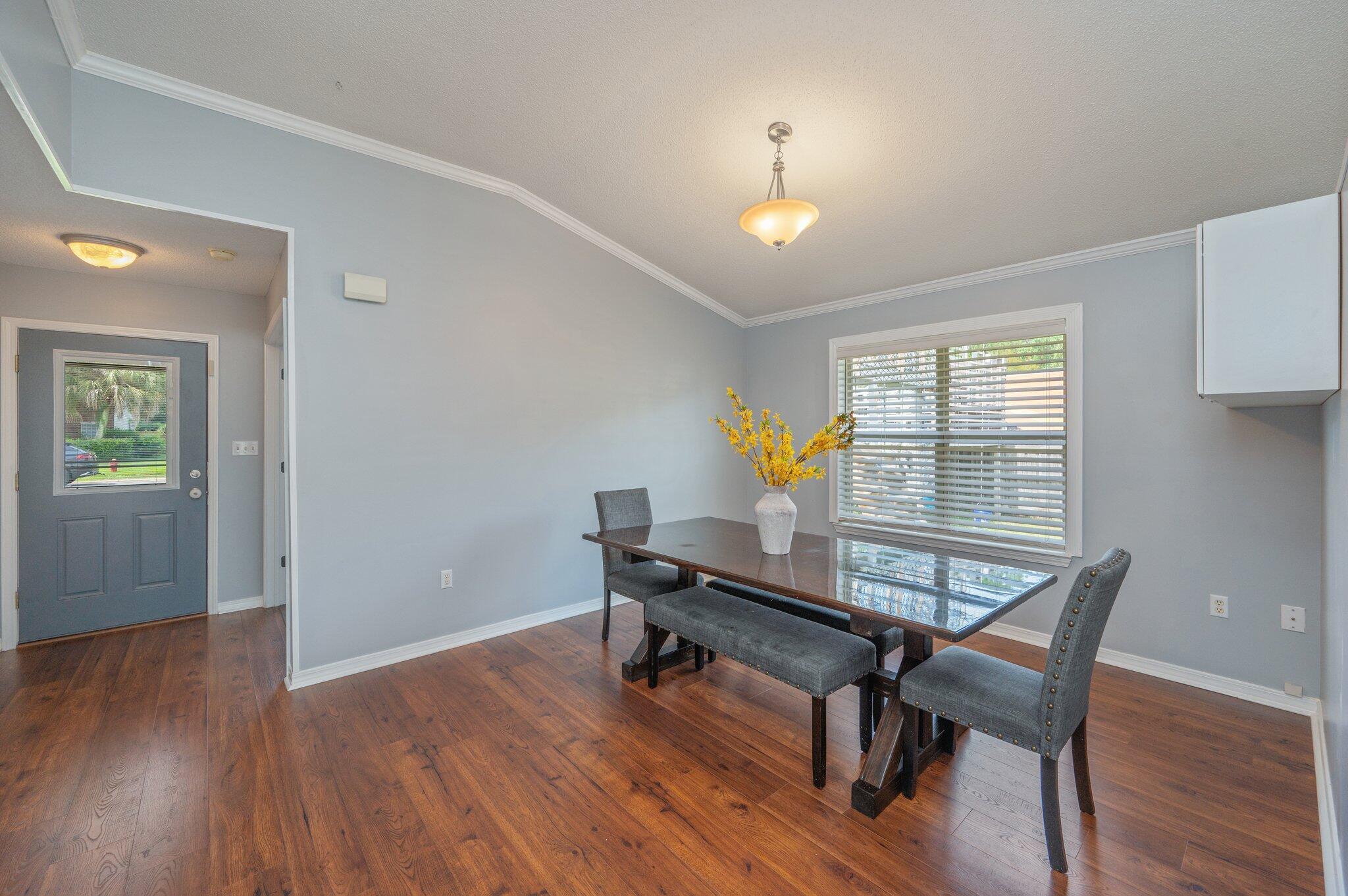 695 Randall Roberts Road Fort Walton Beach, FL 32547 - Photo 10 of 40 a workspace room with wooden floor table and windows