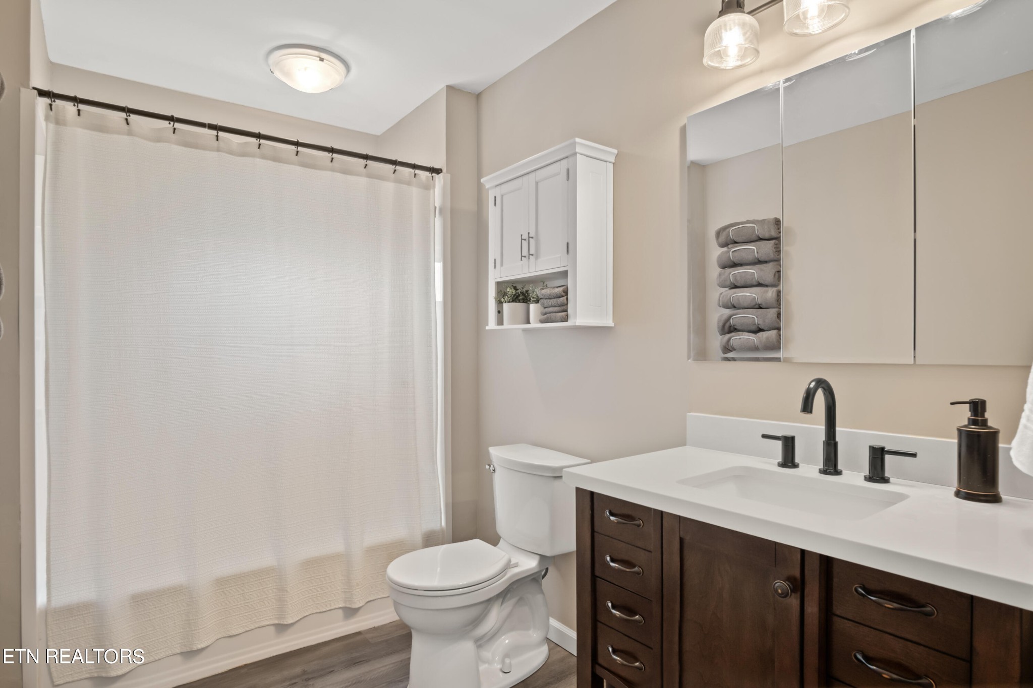 3674 Pleasant Ridge Road Talbott, TN 37877 - Photo 36 of 60 a bathroom with a sink toilet a mirror and shower