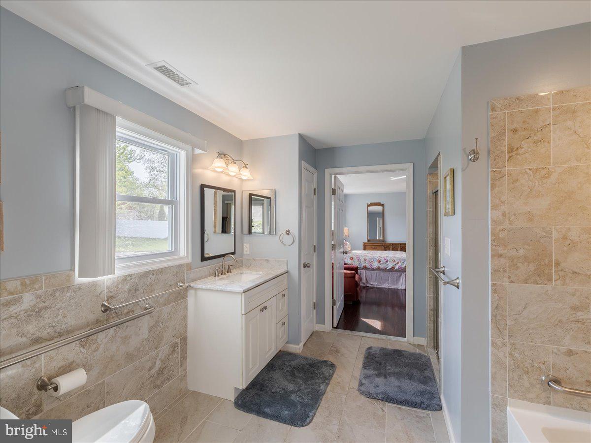 45 Shelley Road Southampton, PA 18966 - Photo 13 of 31 a en suite bathroom with a granite countertop sink and a mirror