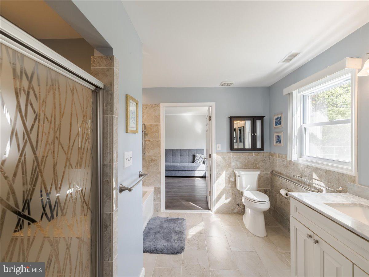 45 Shelley Road Southampton, PA 18966 - Photo 16 of 31 a spacious bathroom with a granite countertop sink toilet and shower