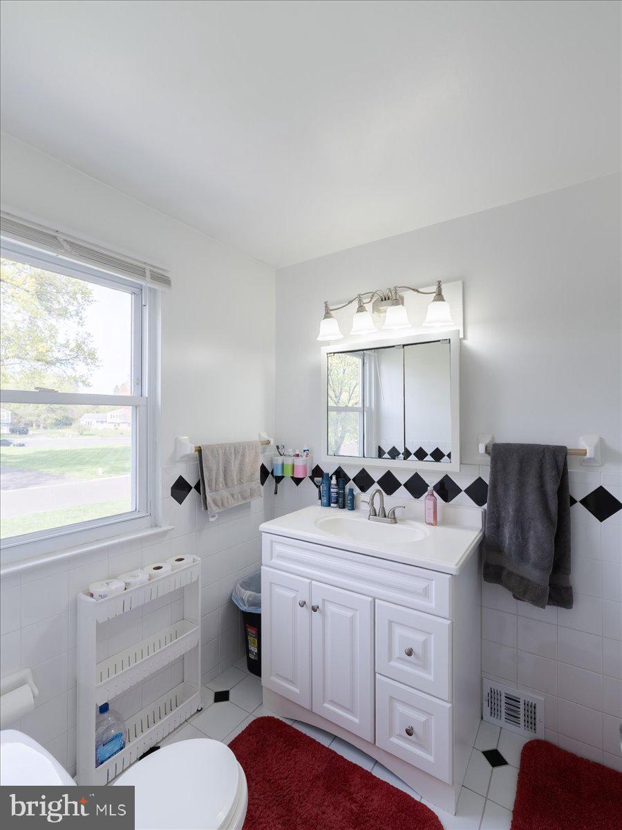 45 Shelley Road Southampton, PA 18966 - Photo 25 of 31 a bathroom with a sink toilet vanity and window