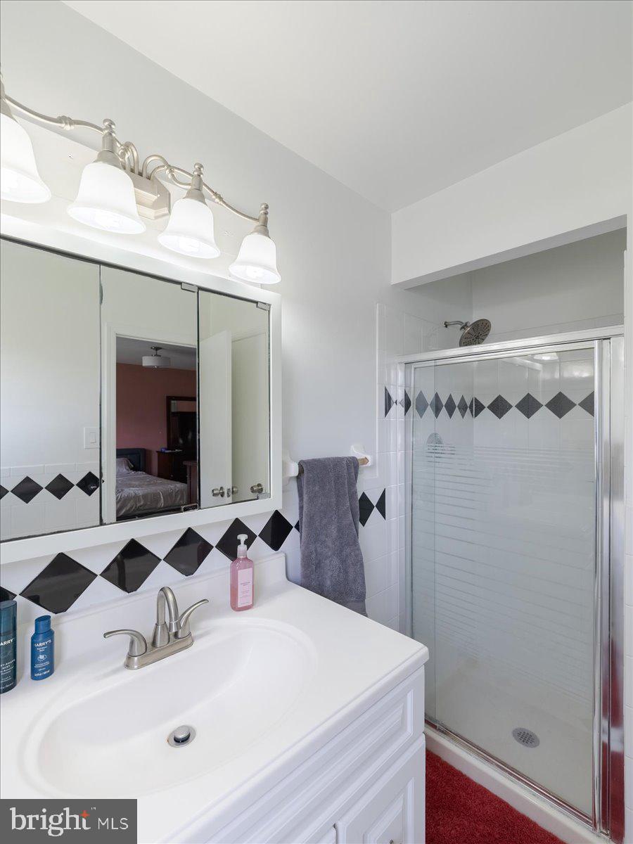 45 Shelley Road Southampton, PA 18966 - Photo 26 of 31 a bathroom with a sink and a mirror