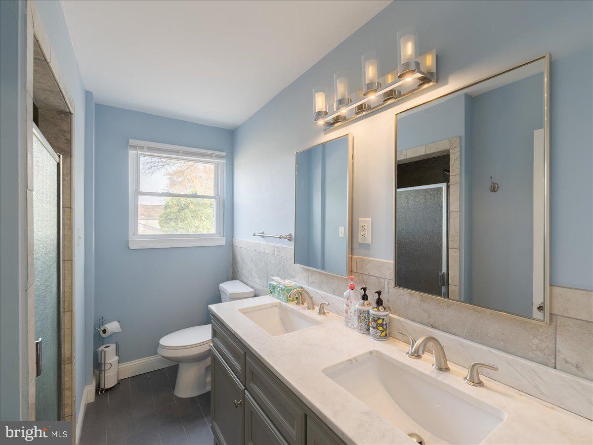 45 Shelley Road Southampton, PA 18966 - Photo 28 of 31 a bathroom with a toilet a sink and mirror