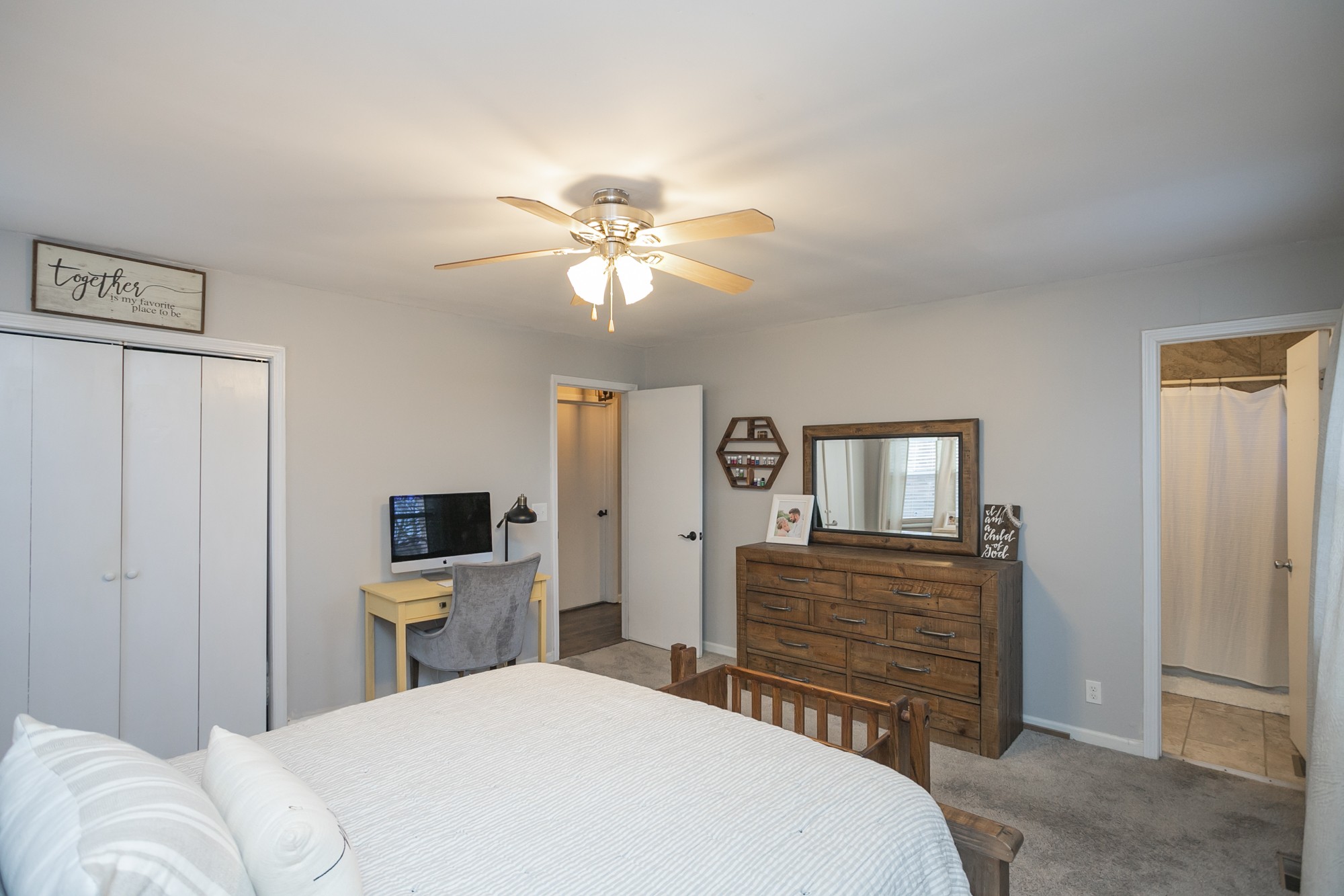 1124 Jacksons View Road Hermitage, TN 37076 - Photo 12 of 22 a bedroom with a bed and a chandelier