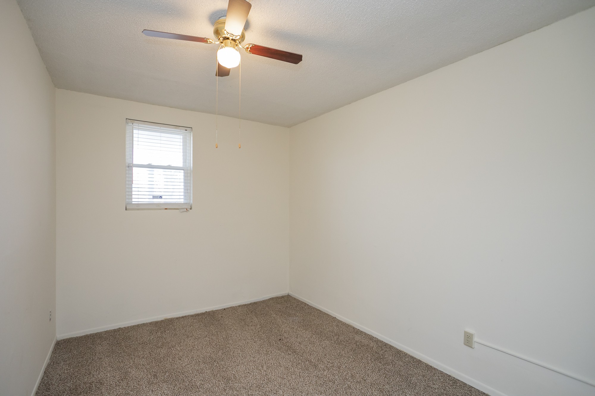 1124 Jacksons View Road Hermitage, TN 37076 - Photo 17 of 22 an empty room with a window and ceiling fan