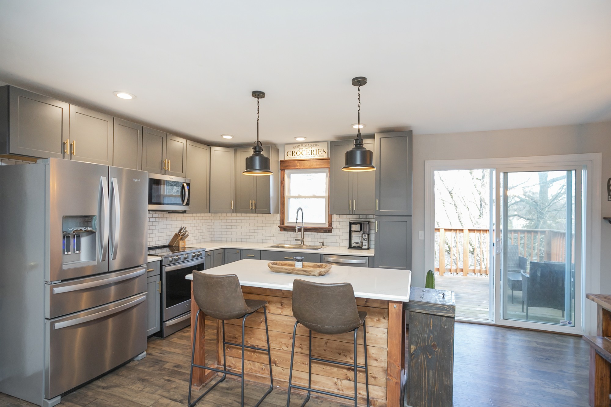 1124 Jacksons View Road Hermitage, TN 37076 - Photo 7 of 22 a kitchen with stainless steel appliances granite countertop a refrigerator a sink a stove a dining table and chairs