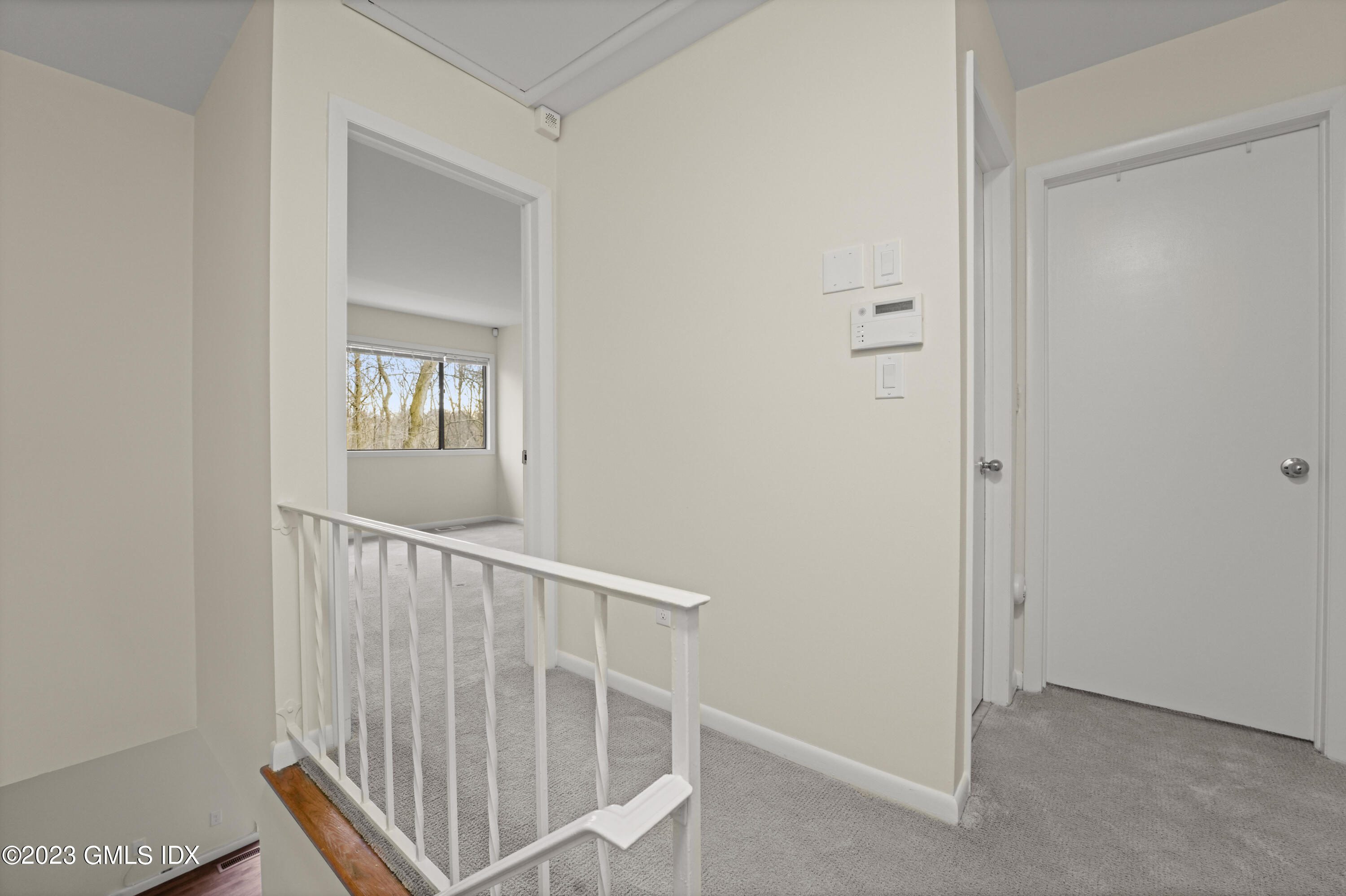 76 Silo Circle, Unit 76 Riverside, CT 06878 - Photo 16 of 40 a view of a hallway with windows