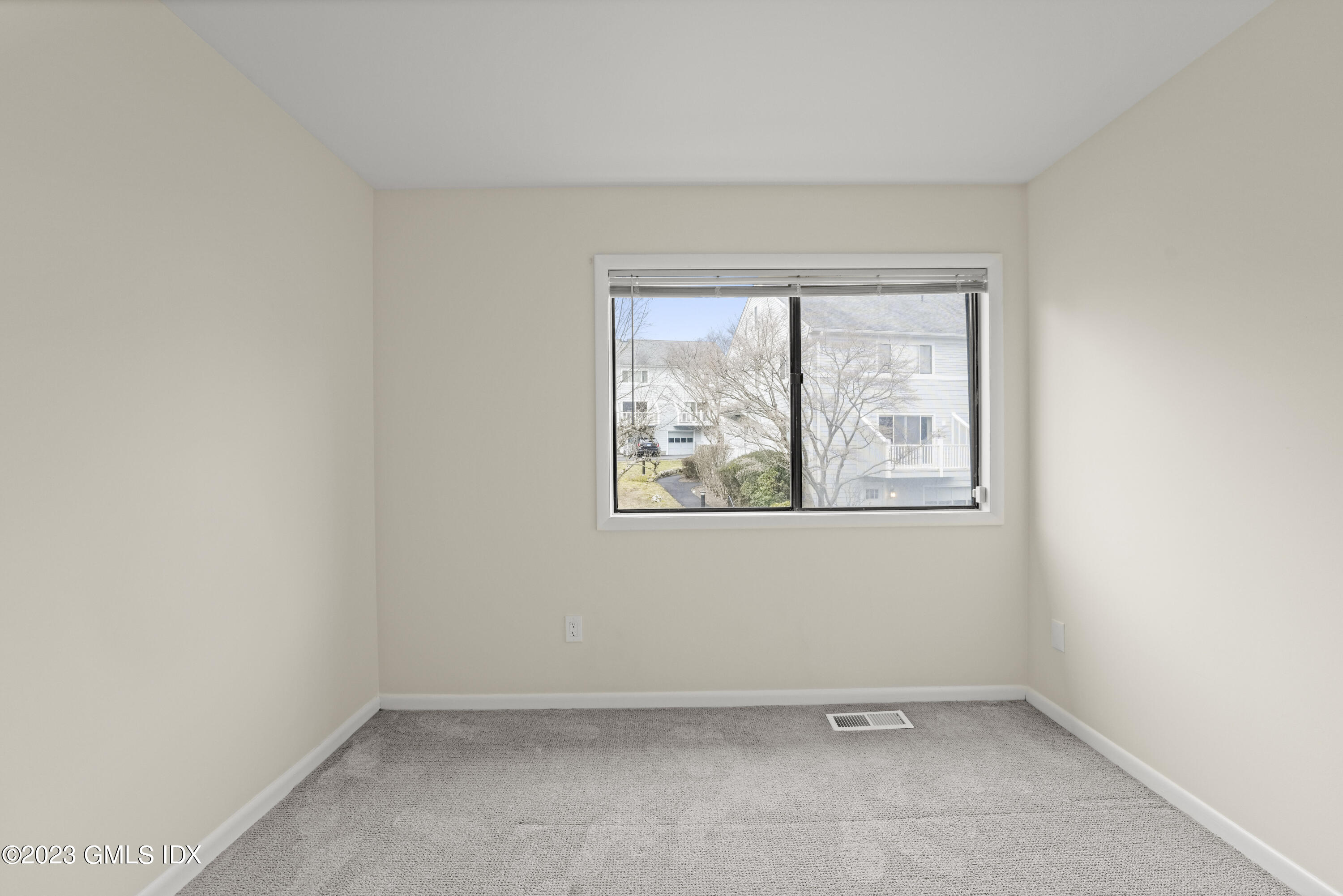 76 Silo Circle, Unit 76 Riverside, CT 06878 - Photo 25 of 40 an empty room with a window