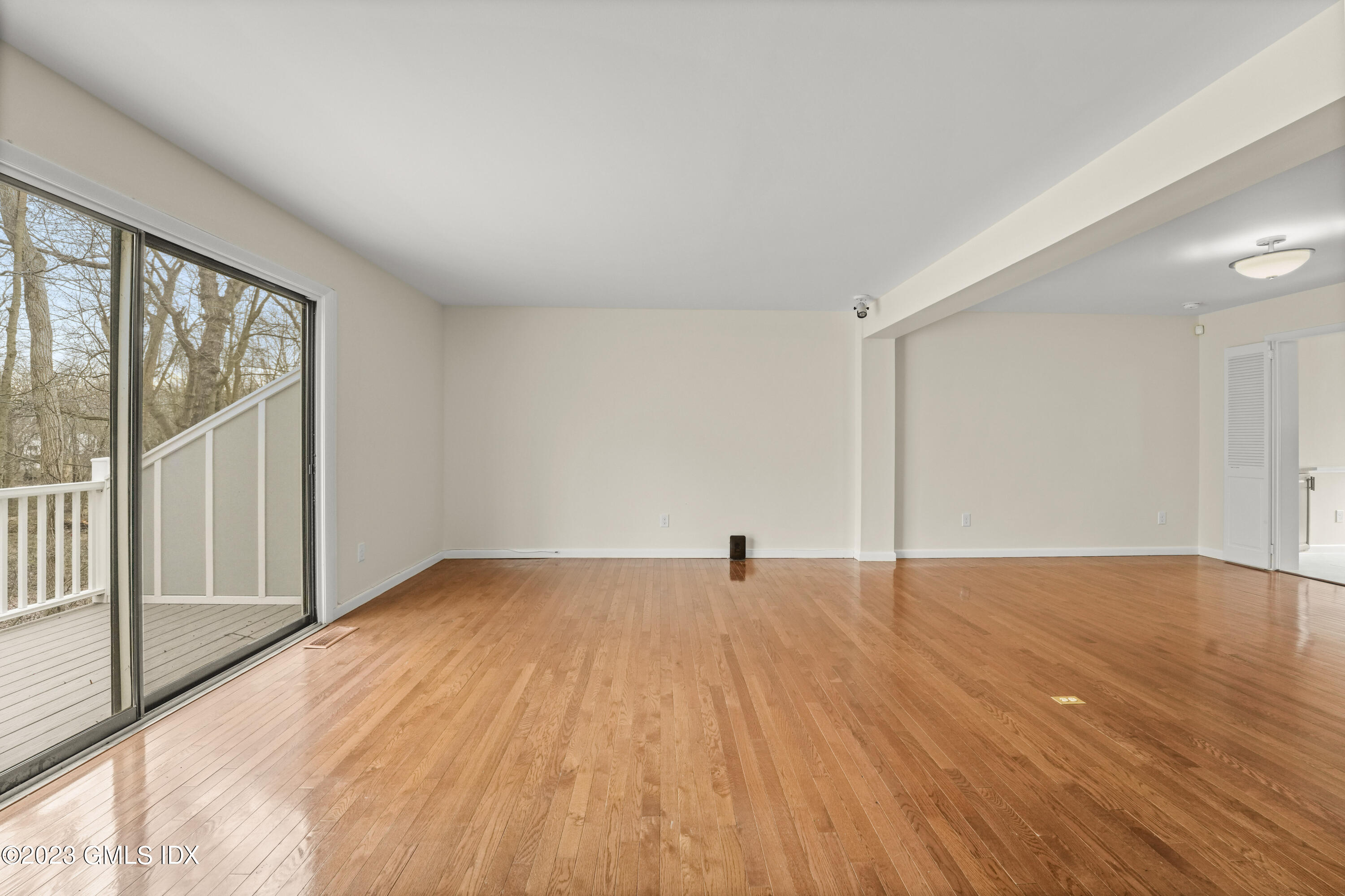 76 Silo Circle, Unit 76 Riverside, CT 06878 - Photo 4 of 40 a view of empty room with wooden floor and fan