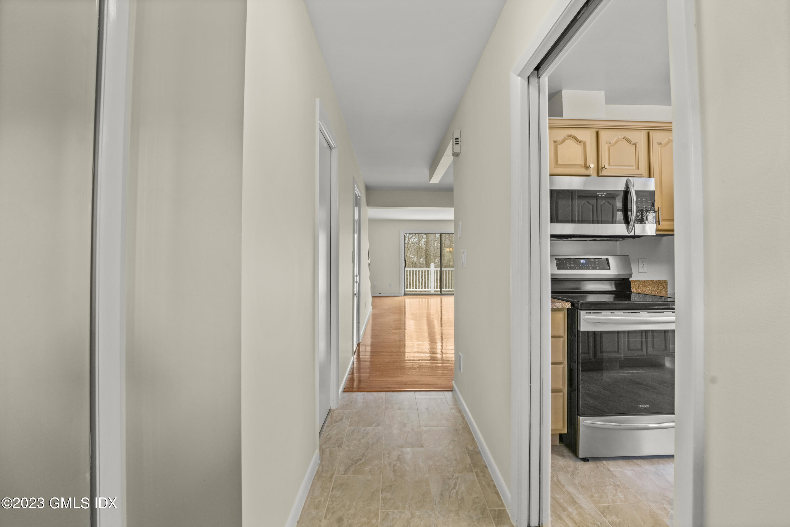 76 Silo Circle, Unit 76 Riverside, CT 06878 - Photo 9 of 40 a view of a hallway with wooden floor and entryway