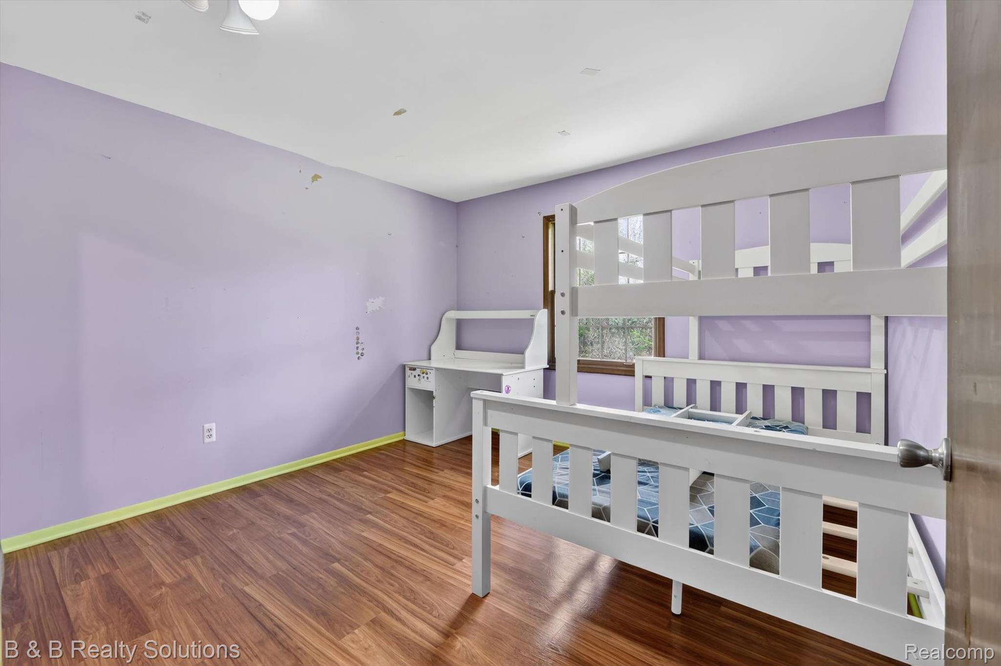 2467 North Lake George Road Metamora, MI 48455 - Photo 26 of 46 Bedroom featuring dark wood-type flooring and baseboards