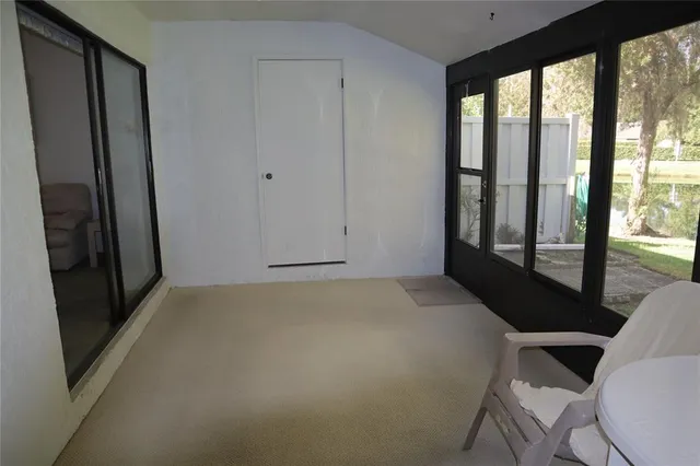 a view of room with window and furniture