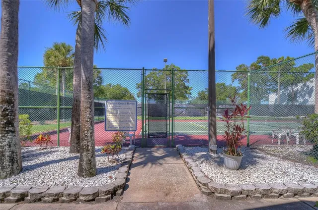 a view of a patio with table and chairs potted plants
