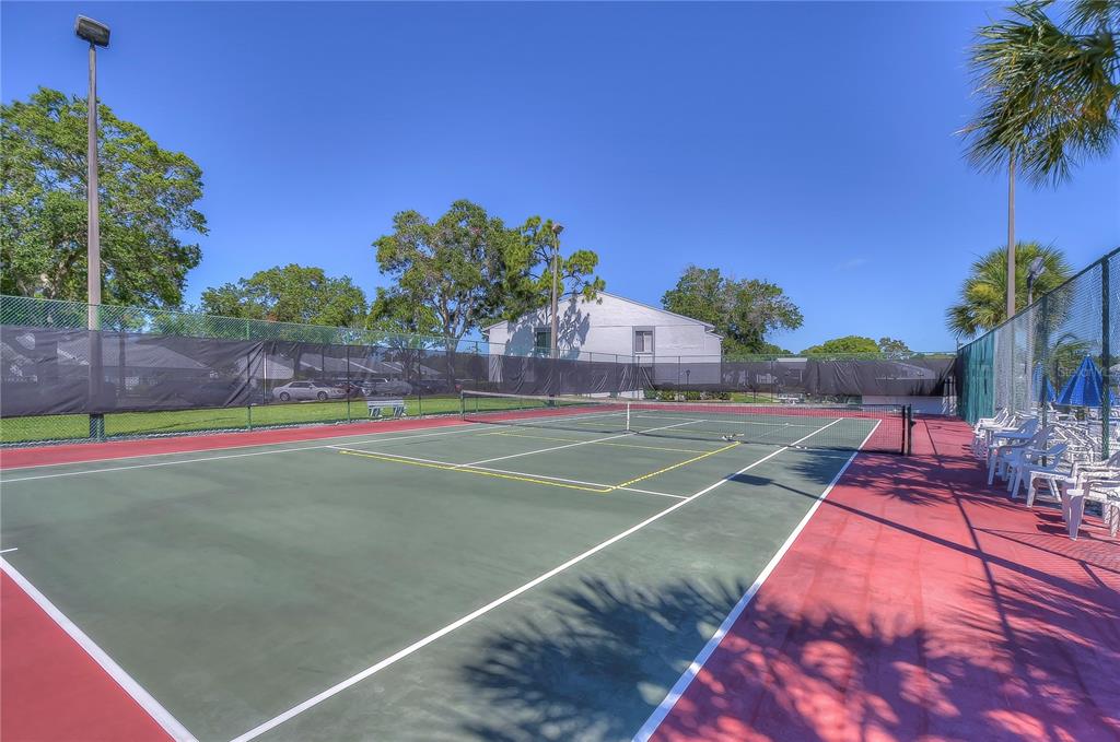 1389 Pine Ridge Circle East, Unit D8 Tarpon Springs, FL 34688 - Photo 27 of 30 a view of basketball court