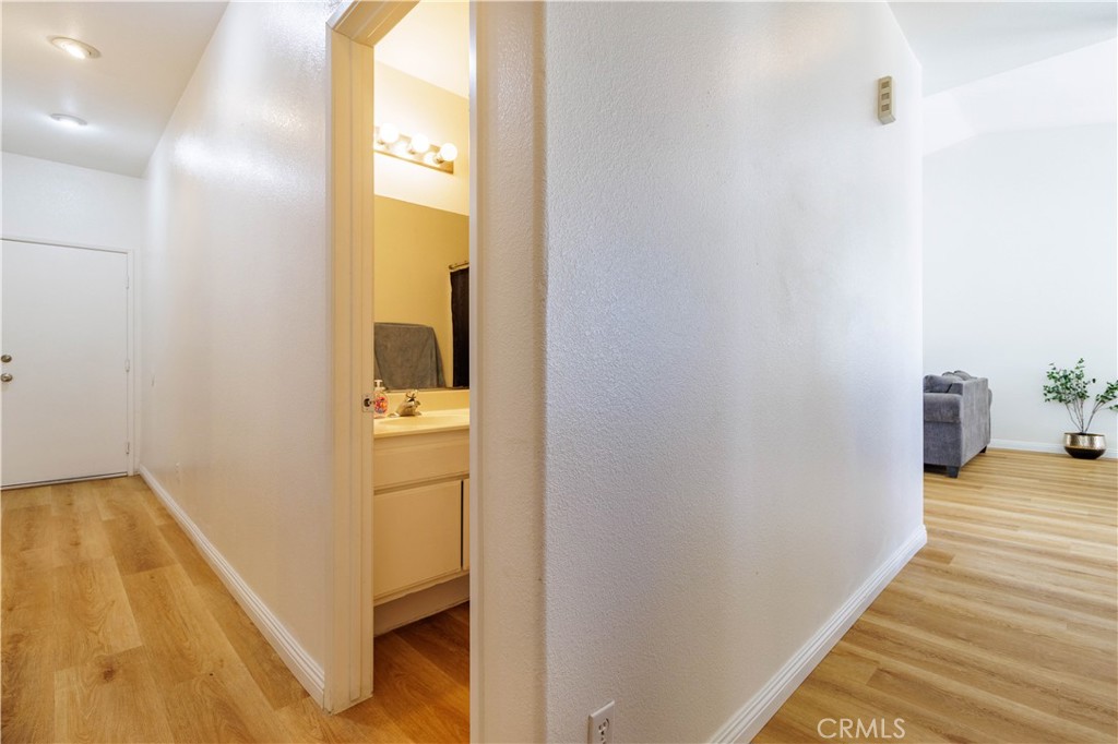 1393 Rabbit Peak Way Hemet, CA 92545 - Photo 18 of 34 a view of a bathroom from a hallway