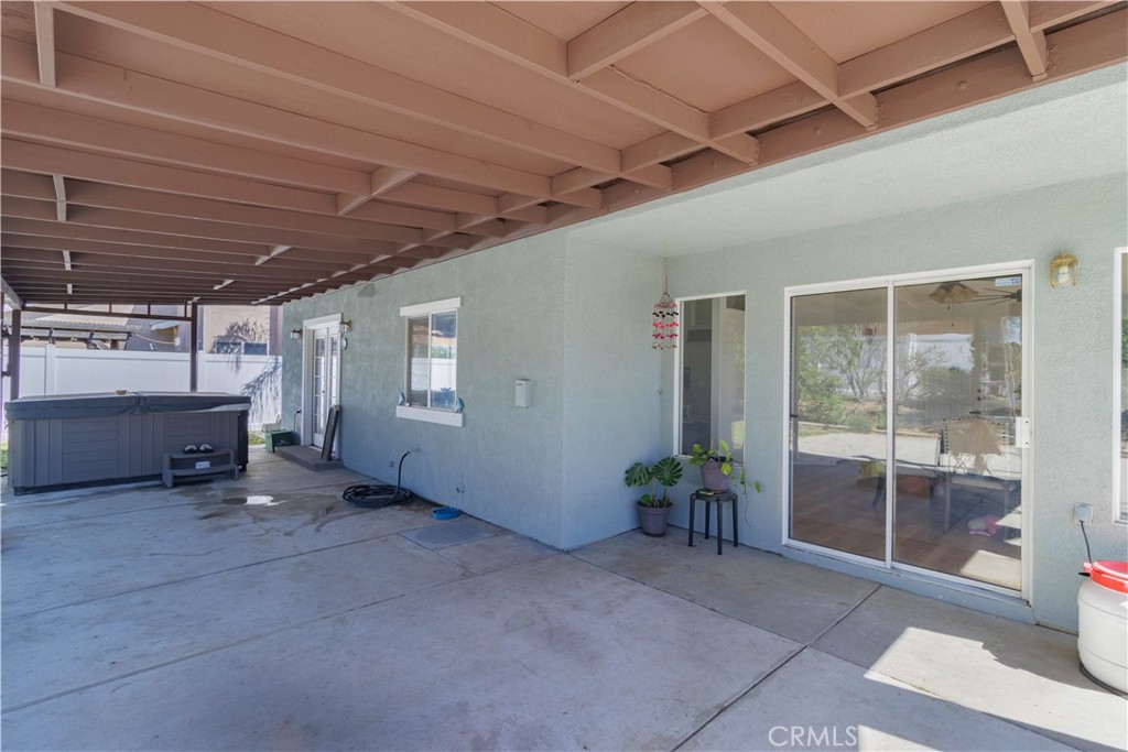 1393 Rabbit Peak Way Hemet, CA 92545 - Photo 29 of 34 a view of a hallway with wooden fence