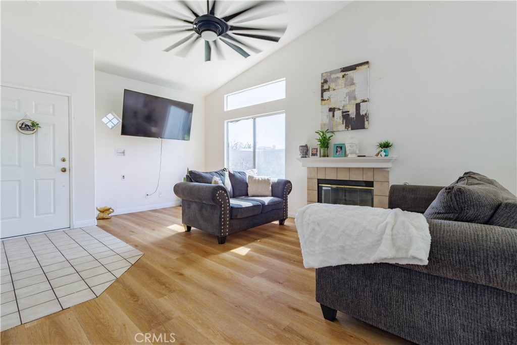 1393 Rabbit Peak Way Hemet, CA 92545 - Photo 7 of 34 a living room with furniture and a fireplace