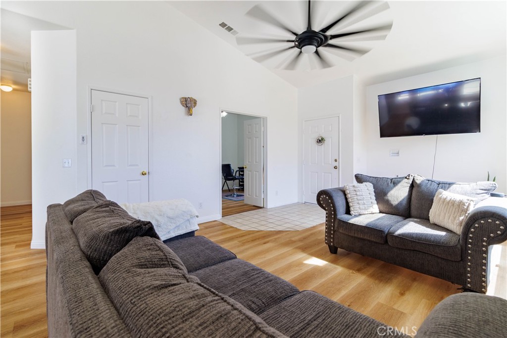 1393 Rabbit Peak Way Hemet, CA 92545 - Photo 8 of 34 a living room with furniture and a flat screen tv