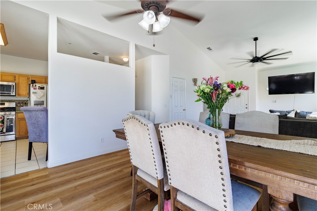 1393 Rabbit Peak Way Hemet, CA 92545 - Photo 10 of 34 a view of a dining room with furniture and a chandelier