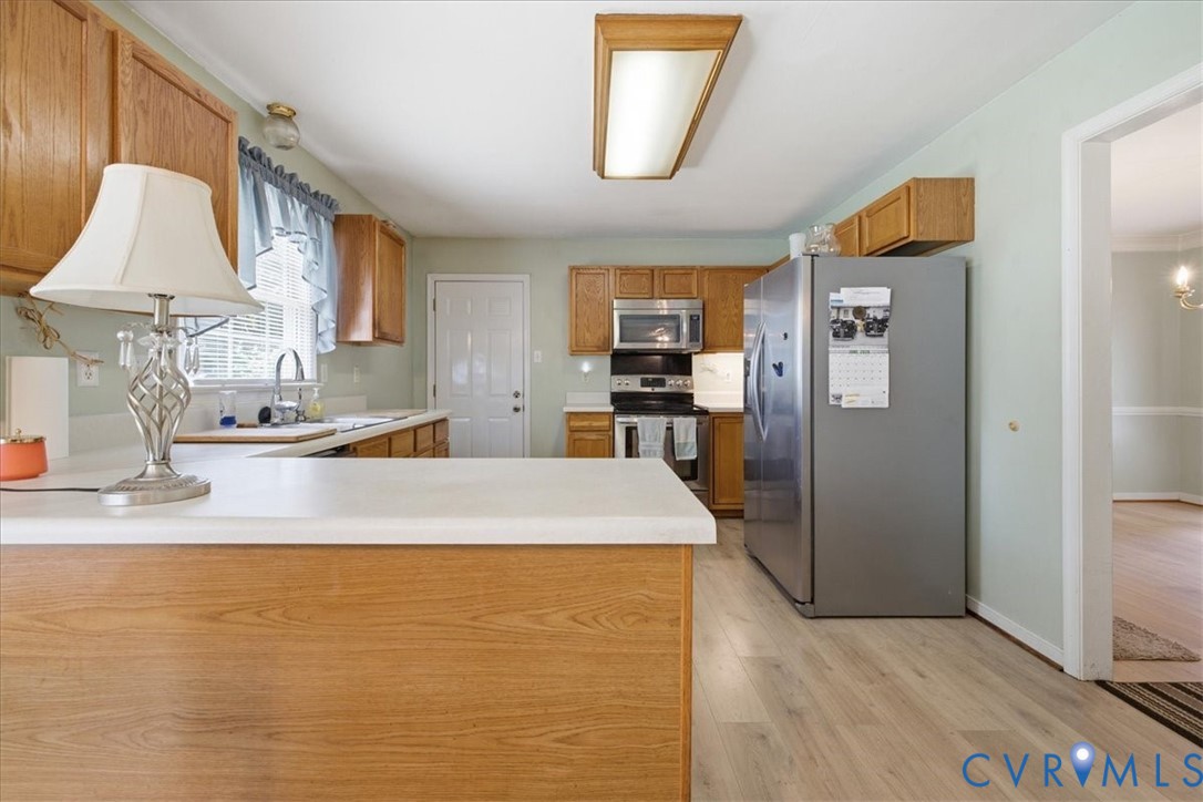 13308 South Chester Road Chester, VA 23831 - Photo 10 of 41 Spacious kitchen featuring wood cabinetry, stainle