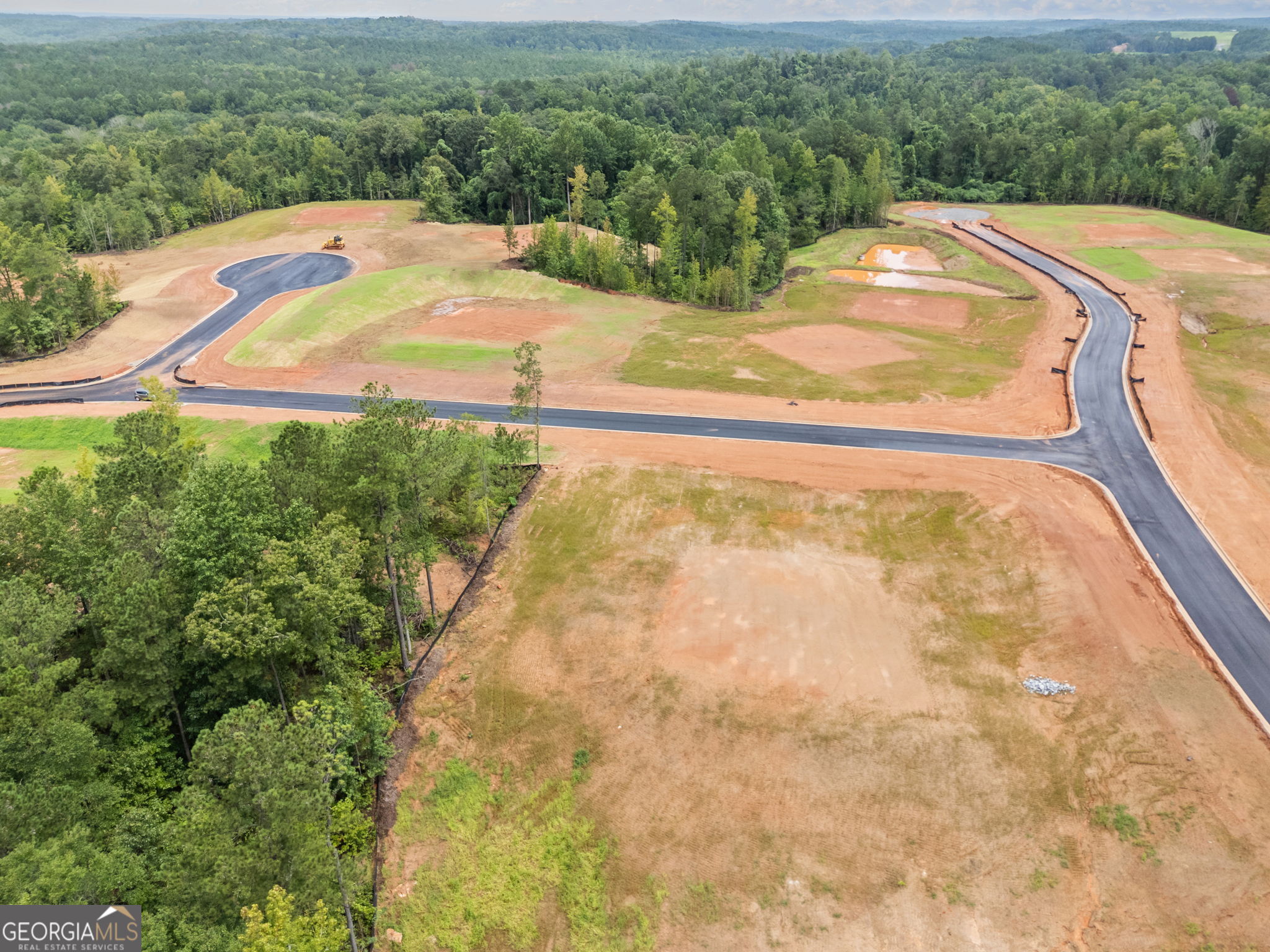 a view of a swimming pool with a yard