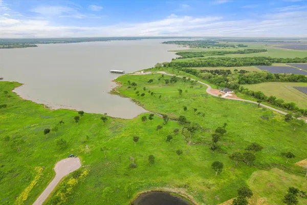a view of a lake with a yard